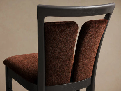 Front view of the Beatrice Dining Side Chair, featuring a dark ash wood frame with brown upholstered seat and split back.