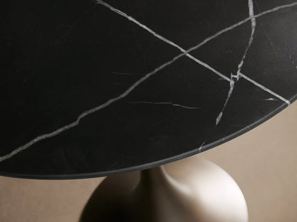Saint Germain Bistro Table with a black marquina marble top and sleek steel base, set against a neutral background.