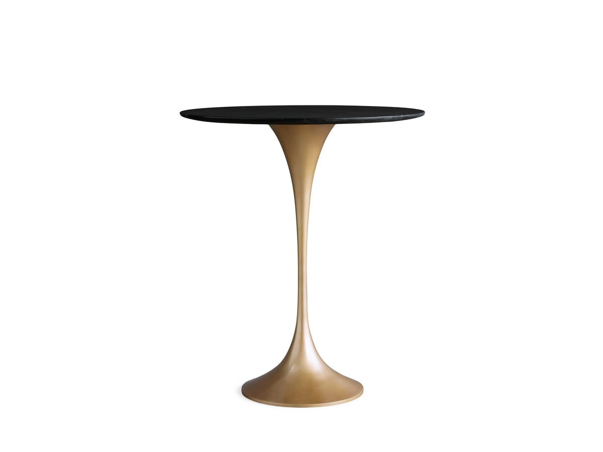Saint Germain Counter Table with a round black marquina marble tabletop featuring white veining, viewed from above on a beige background.