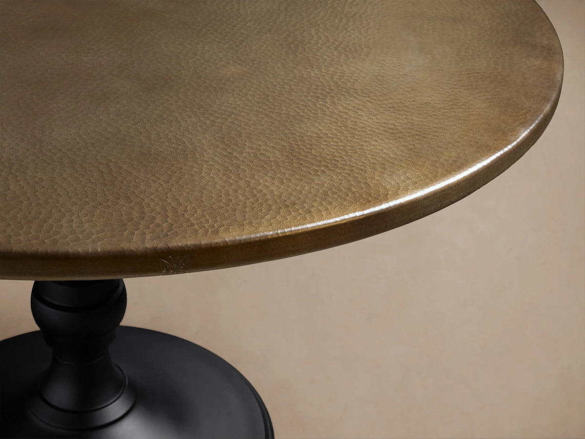 Circular Recycled Metal Dining Tabletop, dark bronze with subtle hammered texture, viewed from above on a light background.
