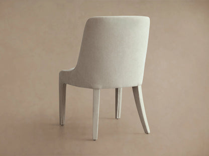 Burns Dining Chair in beige upholstery with elegantly rounded backrest, fully cushioned seat, and sturdy legs on a neutral background.