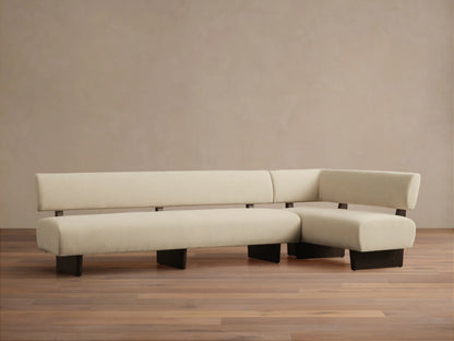 Beau Banquette: L-shaped, minimalist sofa with low back, light beige upholstery, and dark brown frame on wood floor.
