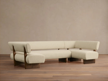 Beau U-Shaped Banquette. Cream textured upholstery, dark wood frame & base. Front view on wood floor.