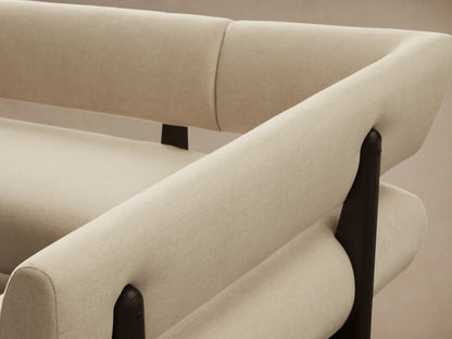 Light beige Beau U-Shaped Banquette with dark wooden bases, angled view on a warm hardwood floor.