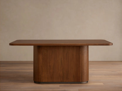 Caden Wood Dining Table: Rectangular top with rounded corners, solid pedestal base, rich walnut wood finish.