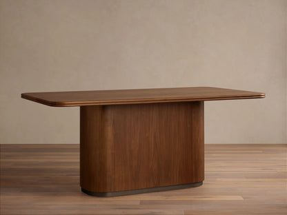 Caden Wood Dining Table: Rectangular top with rounded corners, solid pedestal base, rich walnut wood finish.