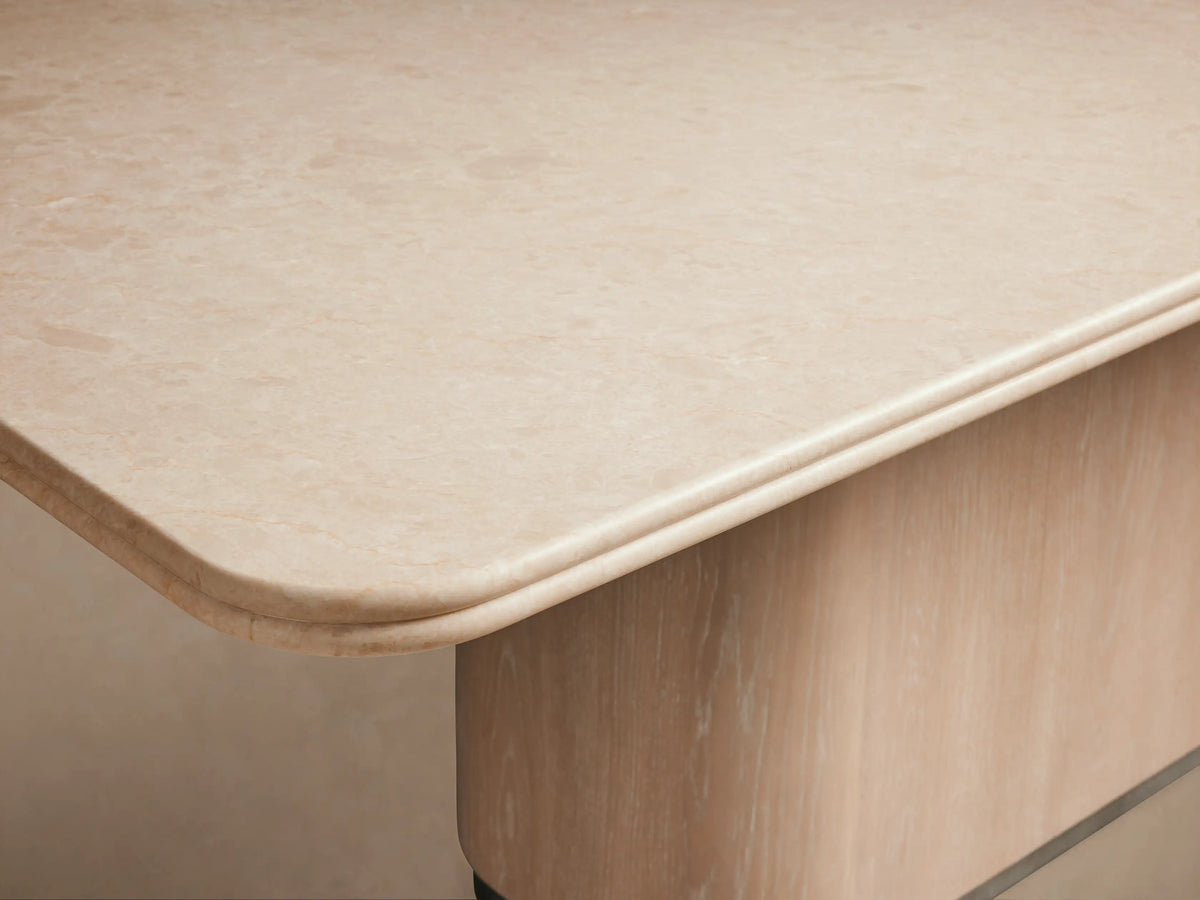 Caden Dining Table, light sand finish rectangular top with rounded corners, on curved oak veneer pedestal base.