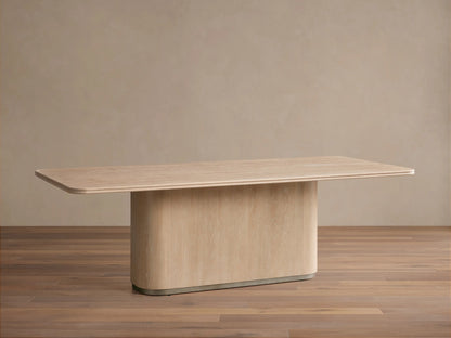Caden Wood Dining Table with a sand finish. Light wood, rectangular top with rounded corners, solid pedestal base.