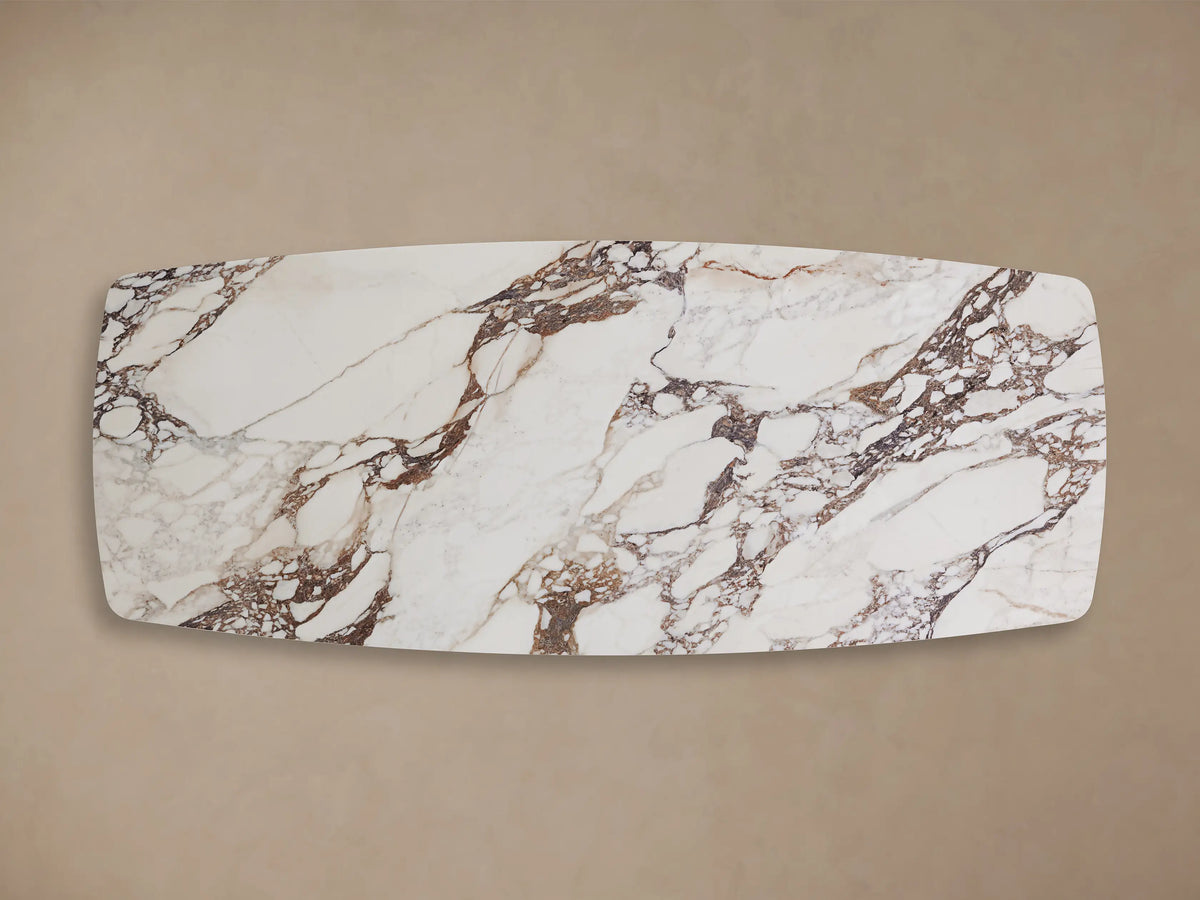 Vincenza Dining Table with Launette Base, featuring a calacatta marble-patterned ceramic tabletop and a sleek steel base.