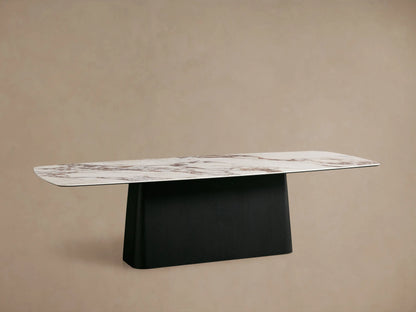 Vincenza Dining Table with a ceramic top mimicking calacatta marble and a solid wood black Toulouse base in a minimalist setting.
