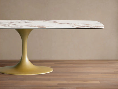 Vincenza Dining Table with ceramic top mimicking calacatta marble pattern, features a gold-colored steel base.