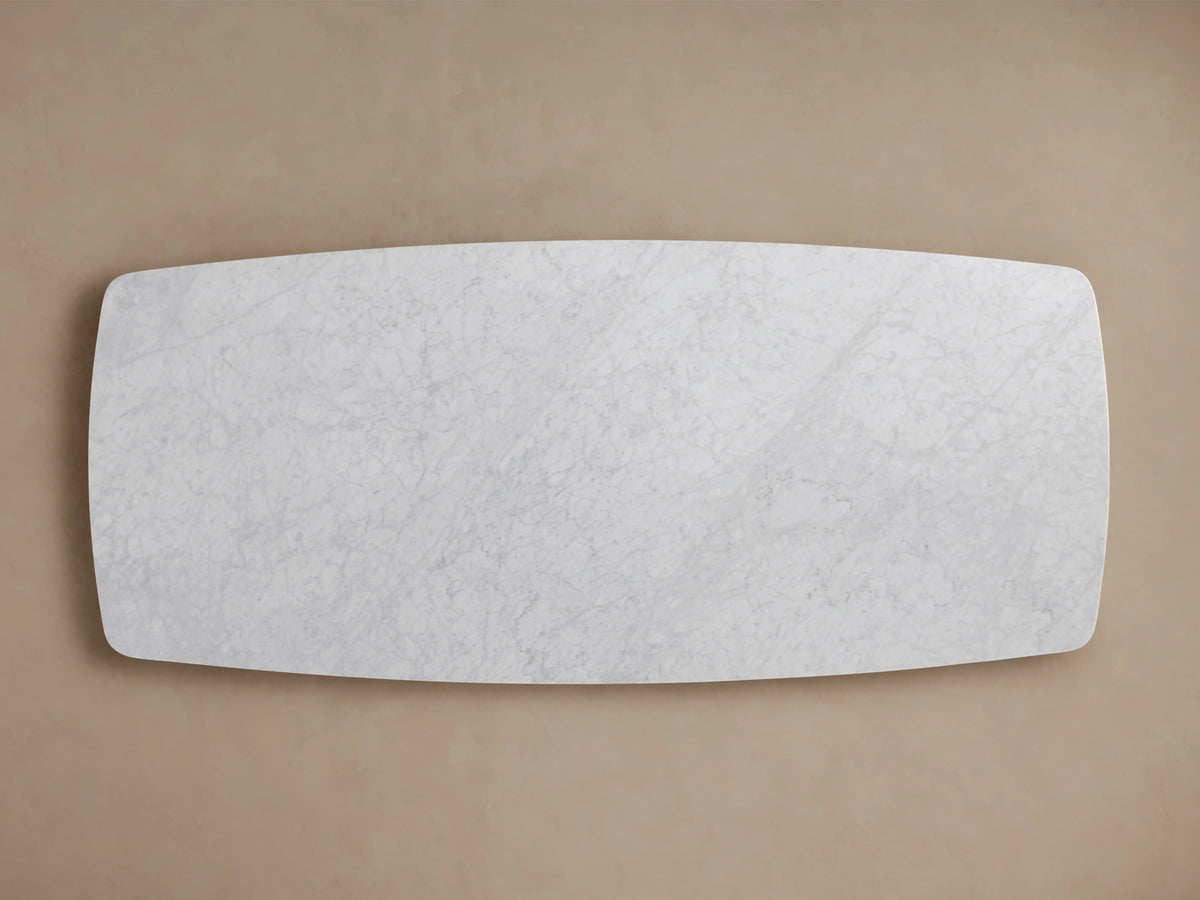 Saint Germain Stone Dining Table, rectangular Carrara marble top, soft grey veining, smooth finish, viewed from above.