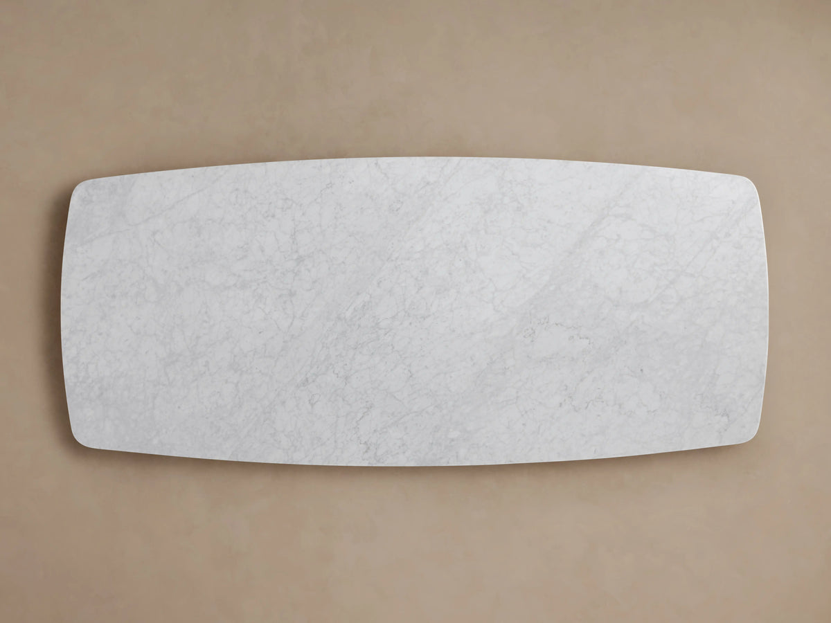 Marble tabletop with a smooth, light gray surface featuring subtle veining patterns, set against a neutral background.