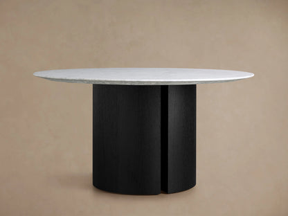Saint Germain Round Stone Dining Table Carrara marble top, white with intricate grey veining, centered on a neutral beige background.