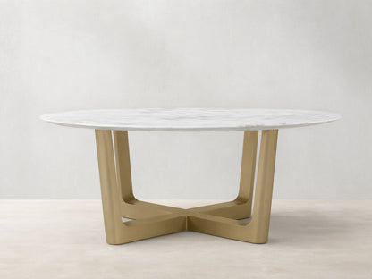 Front view of the White Carrara marble Saint Germain Round Stone Dining Table with Antique Brass Rennes Base in Metal.