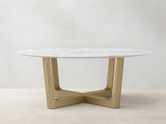 Front view of the White Carrara marble Saint Germain Round Stone Dining Table with Antique Brass Rennes Base in Metal.