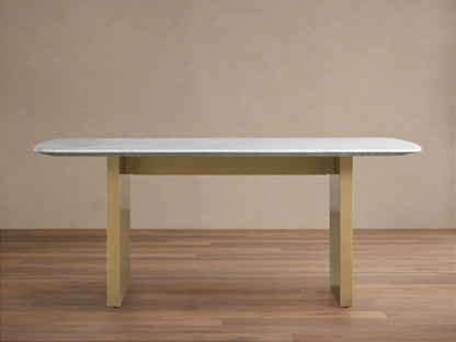 Saint Germain Stone Dining Table with a smooth white Carrara marble top on a sturdy, rectangular antique brass base.