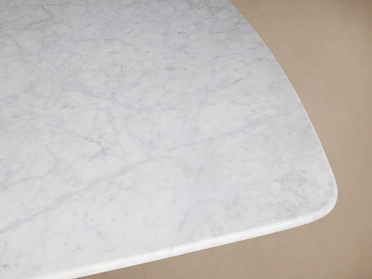 Rectangle Saint Germain Stone Dining Table top made of light gray Carrara marble with natural veining, shown from above.