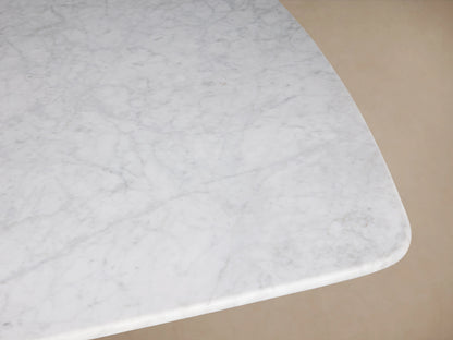 Rectangle Saint Germain Stone Dining Table top made of light gray Carrara marble with natural veining, shown from above.