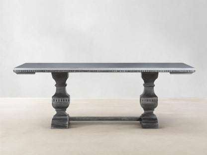 Cerea Amalfi Bell'Arte Dining Table with light gray top, dark distressed pedestal bases, and subtle hand-painted apron detail.