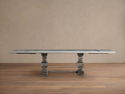 Cerea Amalfi Bell'Arte Dining Table, rectangular distressed gray tabletop, ornate pedestal bases, and stretcher bar.