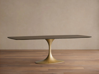 Saint Germain Wood Dining Table with solid oak top in chestnut finish and gold steel Launette base on wooden floor.