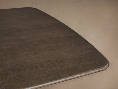 Saint Germain Wood Dining Table with dark oak rectangular top and brass-colored steel pedestal base on wooden floor.