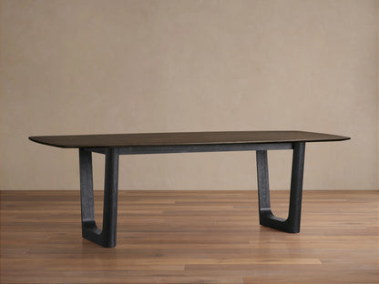 Saint Germain Wood Dining Table with a dark brown tabletop and sturdy rectangular black legs on a wooden floor.