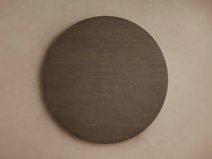 Round wooden tabletop with a smooth, dark brown finish, viewed from above, showing subtle wood grain texture.