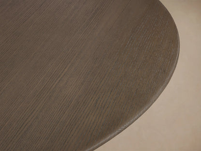 Close-up of the Chestnut wood grain on the round top of the Saint Germain 60" Round Chestnut Top Dining Table.