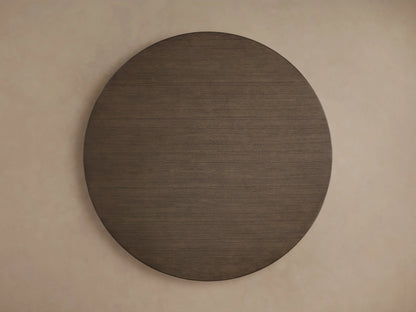 Round wooden tabletop of the Saint Germain Dining Table in a dark chestnut finish, showing detailed wood grain texture.