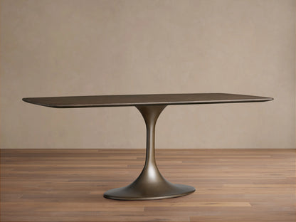 Saint Germain wood dining table with a rectangular solid oak top, dark finish, and a sleek, rounded steel base on wooden floor.