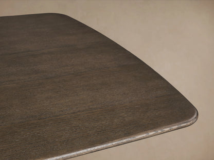 Saint Germain Wood Dining Table with solid oak top in dark finish; features elegant steel pedestal base on wooden floor.