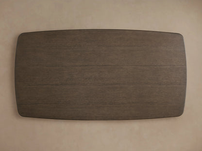 Corner view of the Saint Germain Wood Dining Table's solid oak tabletop with a smooth Chestnut finish, set against a neutral background.