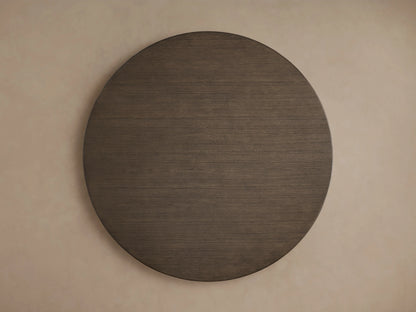 Saint Germain round wood dining table with a smooth, dark oak tabletop, flat view highlighting the texture and finish.