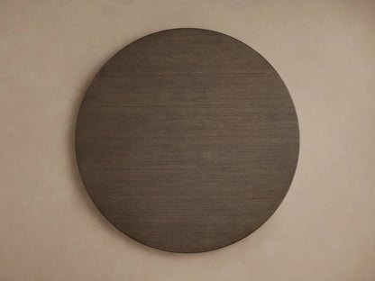 Saint Germain Round Wood Dining Table with a dark wooden top and subtle grain patterns, viewed from above.
