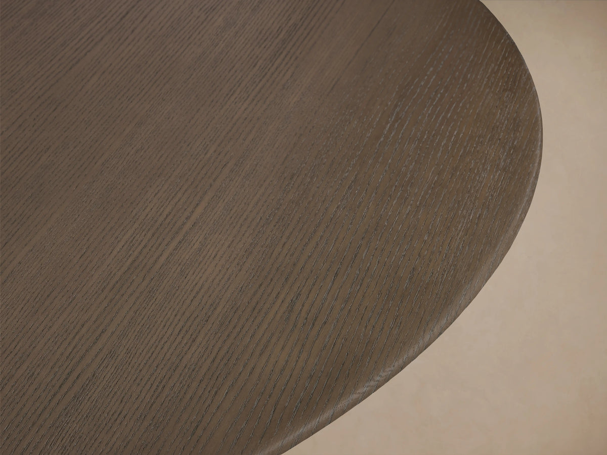 Round wooden tabletop in dark chestnut finish, showing wood grain texture and smooth edges against a neutral background.