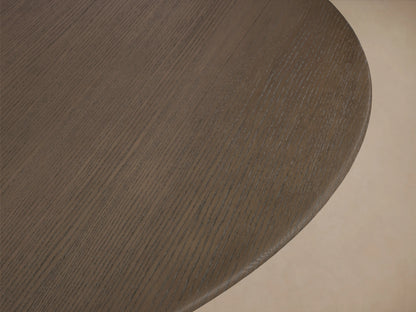 Round wooden tabletop in dark chestnut finish, showing wood grain texture and smooth edges against a neutral background.