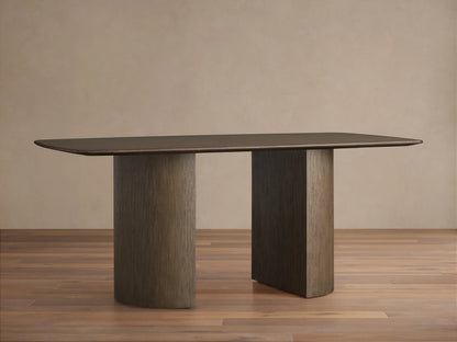 Saint Germain Wood Dining Table with rectangular top, wooden Dauphine base, dark finish, on hardwood floor, beige wall background.