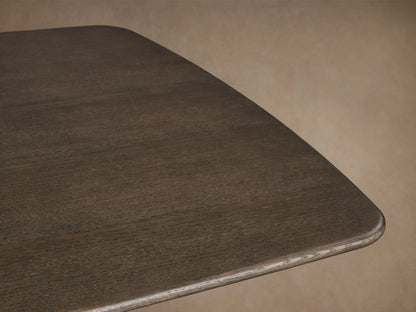 Saint Germain Wood Dining Table with solid oak top in ebony finish and two wide black base legs, set on wooden floor.