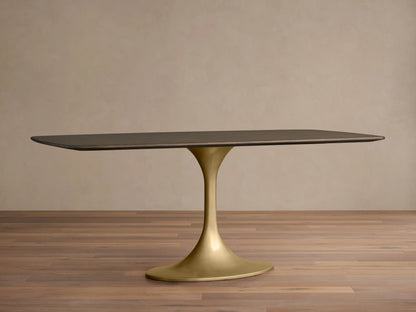 Saint Germain Wood Dining Table with a dark rectangular oak top and sleek gold steel Launette base, on wood floor.