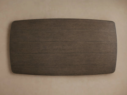 Saint Germain Wood Dining Table with a dark oak top and sleek steel Launette base, set on a wooden floor.