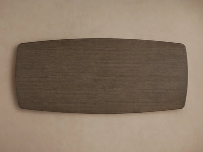Edge of Saint Germain Wood Dining Table with dark oak finish, showing smooth, rounded corners and visible wood grain texture.