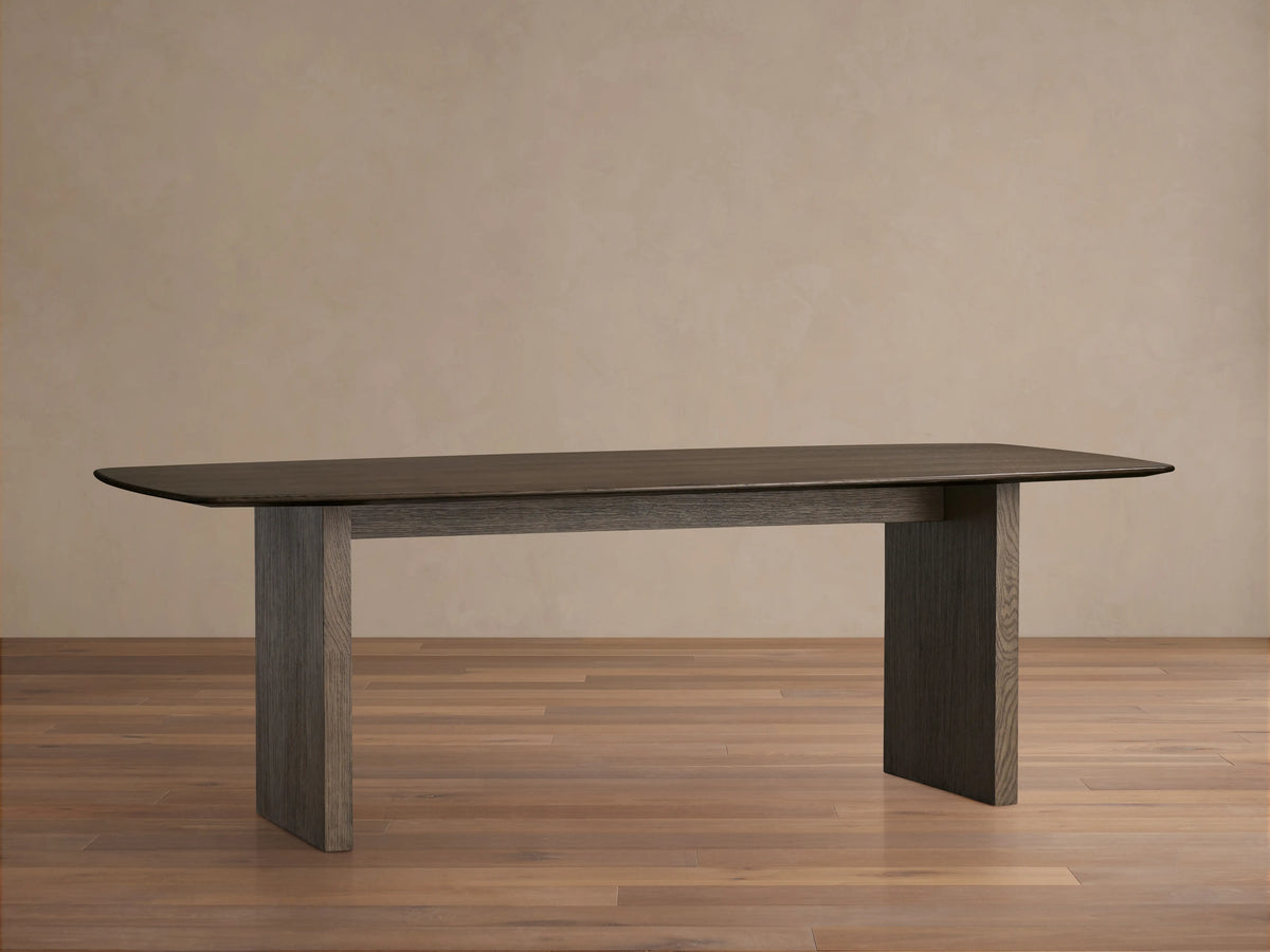 Saint Germain dining table with solid oak wood top in a dark finish and rectangular shape, supported by a matching base.