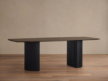 Saint Germain Wood Dining Table, rectangular top, solid oak in chestnut finish, two ebony-finished Dauphine bases, wood flooring background.