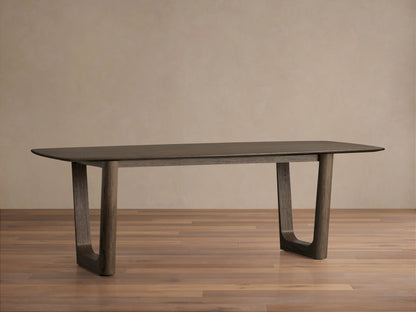 Saint Germain Wood Dining Table with a sleek rectangular top in dark brown finish, supported by thick, rounded legs.