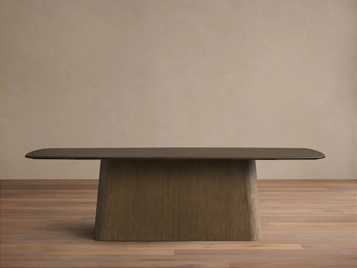 Saint Germain Wood Dining Table with dark ebony tabletop, rounded corners, and a light brown textured Toulouse base.