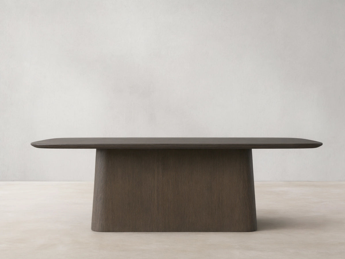 Saint Germain Wood Dining Table with dark ebony tabletop, rounded corners, and a light brown textured Toulouse base.