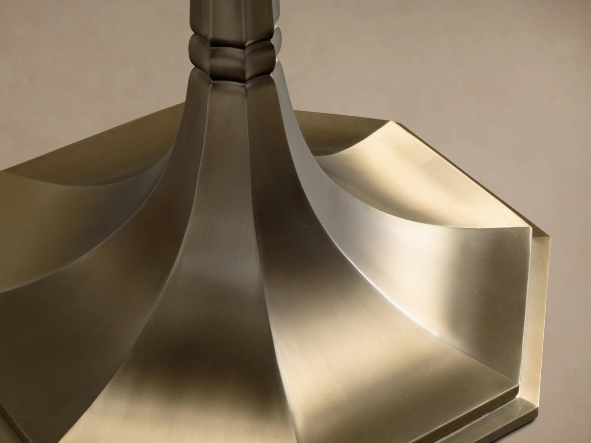 Close-up of the espresso brown marble top of the Clemence Bistro Table, showing white veining and a rounded edge.