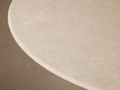Saint Germain Round Dining Table with a cream stone top and a dark, tapered oak veneer Toulouse base.